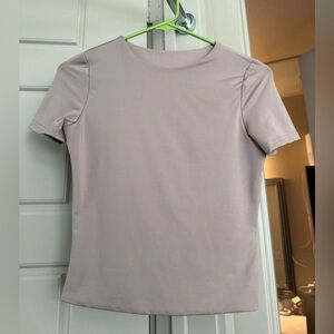 Light brown short sleeve fitted shirt- stretchy material NEVER WORN size XS